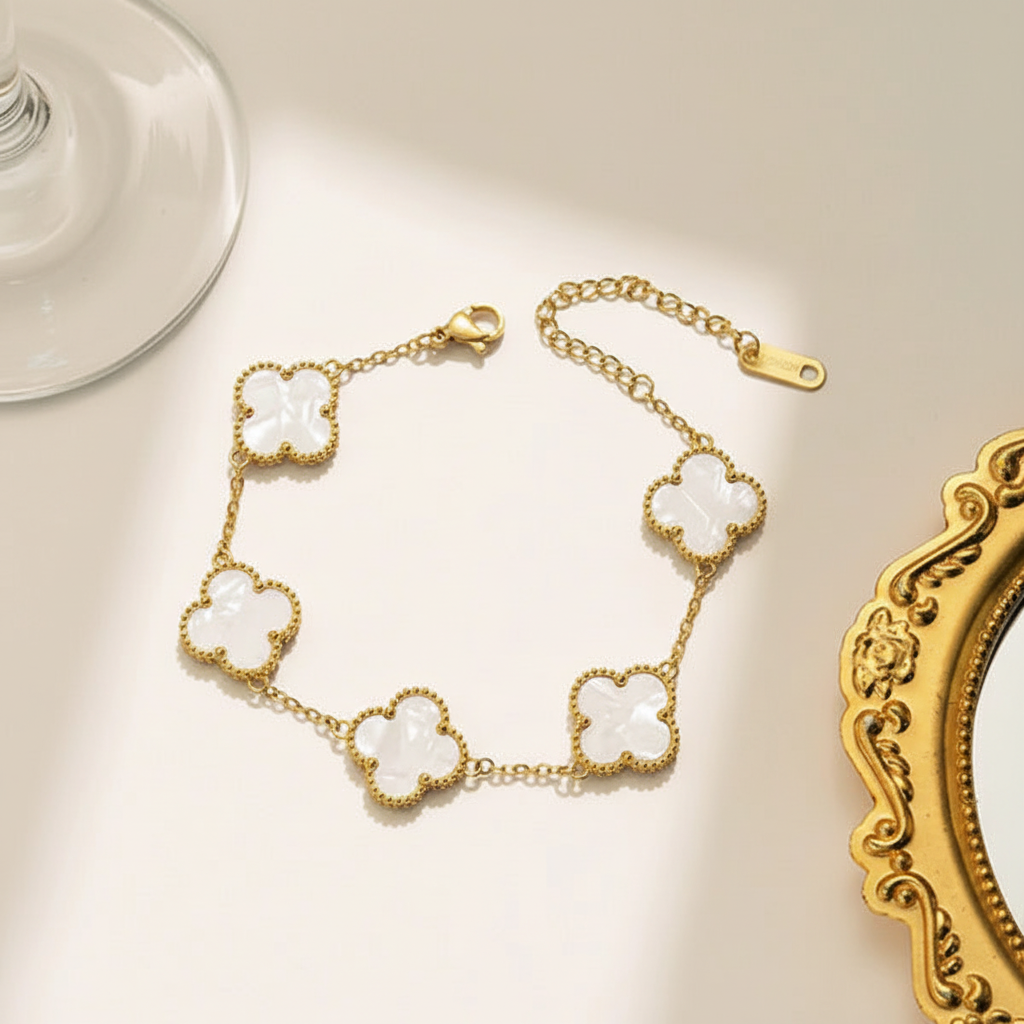 Gold clover bracelet on elegant surface